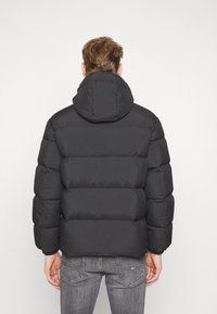 Tommy Jeans Gewatteerde jas - black