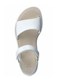 White sandal with a textured upper, wide straps, and a cushioned footbed. Features a smooth sole and adjustable ankle strap.