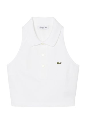 Witte cropped poloshirt zonder mouwen met kraag, drie knopen en klein groen geborduurd Lacoste krokodillenlogo op de borst.
