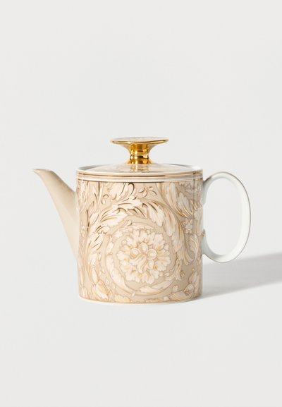 Porcelain teapot with beige floral patterns and gold accents, featuring a round handle and a lid with a gold knob.