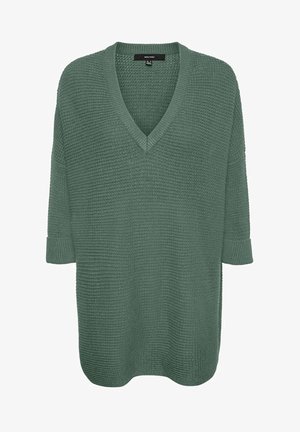 Oversized green sweater with a V-neck, textured knit fabric, three-quarter sleeves, and rolled cuffs. Simple design, no patterns or accents.