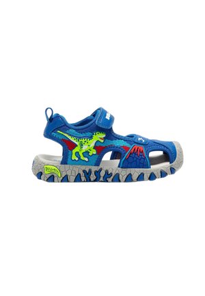 Sandalo blu per bambini con disegni di dinosauri e vulcani, suola grigia con dettagli blu e chiusura con strappo.