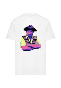White t-shirt featuring a colorful graphic design of a man with arms crossed, wearing a hat and a patterned vest.