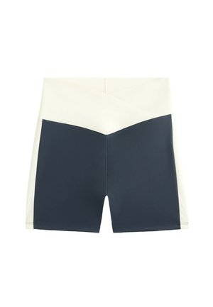 Marinblå och krämfärgade färgblockerade shorts med hög midja, som har en mjuk, stretchig kvalitet och en geometrisk design vid midjan.