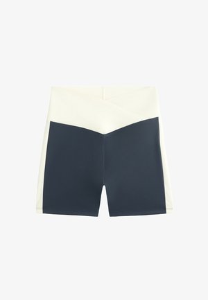 Marinblå och krämfärgade färgblockerade shorts med hög midja, som har en mjuk, stretchig kvalitet och en geometrisk design vid midjan.