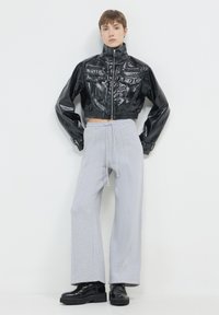 Calliope EFFETTO - Giacca in similpelle - nero