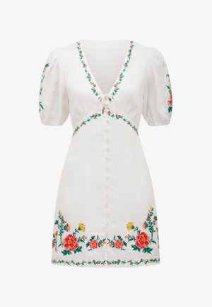 White dress featuring puff sleeves, a deep V-neck, and floral embroidery in colors red, pink, yellow, and green along the neckline and hem.