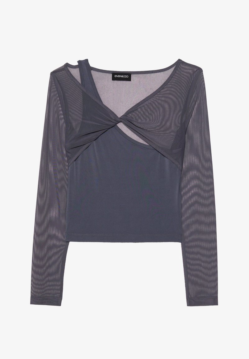 Graues Langarmoberteil mit einer eng anliegenden Unterlage und einem transparenten Mesh-Overlay, drehelastischem Detail an der Vorderseite und einem Rundhalsausschnitt.