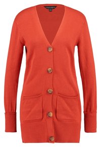 Oranje gebreide cardigan met een V-hals, vijfhouten knopen, twee frontzakken en geribbelde manchetten. Zachte textuur en ontspannen pasvorm.