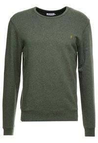 Felpa verde realizzata in tessuto morbido, con un colletto a girocollo, maniche lunghe, polsini e orlo a costine, e un piccolo logo ricamato in giallo.