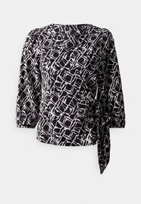 Blouse à motifs noir et blanc avec des manches trois-quarts, design croisé, tissu texturé et un détail de nouage sur le côté.