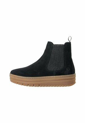 Bottines en daim noir avec des panneaux latéraux extensibles, une languette de tirage et une semelle en caoutchouc marron clair comportant un motif texturé.