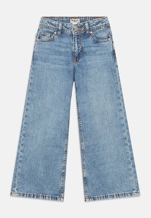 Wide-leg light blue jeans made of denim, featuring a button closure, five pockets, and stitched detailing along the seams.