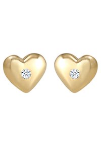 Goldene herzförmige Ohrringe mit einer polierten Oberfläche und einem kleinen, klaren Edelstein in der Mitte jedes Ohrrings.