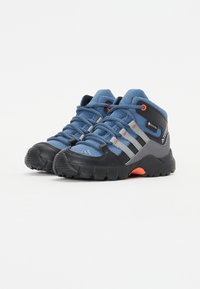 Blue synthetic hiking shoes with grey accents, black rubber sole, and orange laces. Features waterproof Gore-Tex branding on the side.