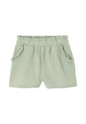 Light green cotton toddler shorts with elastic waistband and ruffled trim on front pockets.