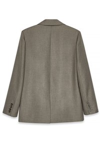 Blazer gris en tissu texturé, avec une fente arrière simple, des revers crantés et des poignets à trois boutons. Design simple et ajusté, sans embellissements visibles.