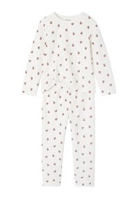 White pajama set with long sleeves and pants, featuring small red fruit patterns. Soft fabric with a knotted accent at the waist.