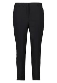 Pantalones negros ajustados con un corte slim, que presentan una textura suave, un frente plano y bolsillos laterales discretos.