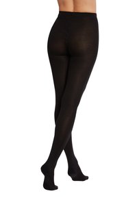 Svarta ogenomskinliga strumpbyxor med en mjuk textur, hög midja och sömlös design, som sträcker sig ner till ankeln med en subtil lyster.