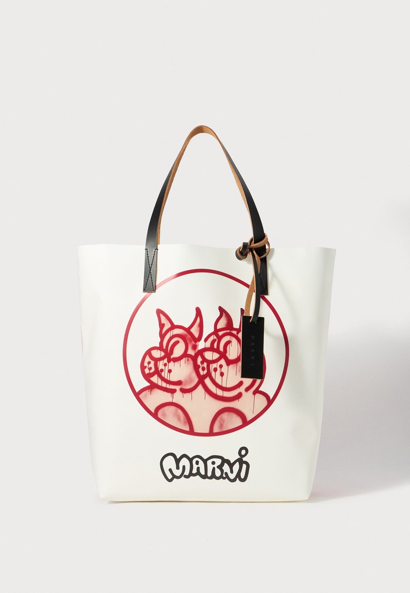 Tote bag with a white exterior, black handles, and a red circular graphic featuring two cartoon-like characters. Text "MARNI" at the bottom.