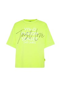 Neon-gelb übergroßes T-Shirt aus Baumwolle, mit Fronttext in Weiß und Schwarz sowie einem Etikett auf der linken Seite.