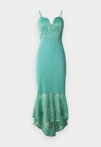 O rochie verde mentă cu un buchet din dantelă și un tiv din dantelă stratificat. Are un decolteu adânc și bretele subțiri, ajustabile.