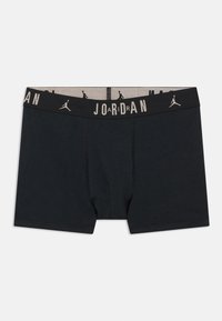 Μαύρα σλιπ μποξέρ ανδρών με το λογότυπο της Jordan και σιλουέτες του Jumpman στη μέση, σε λευκό φόντο.