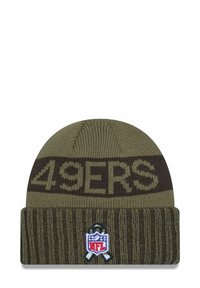 Dark green knitted beanie with "49ERS" in brown lettering, featuring a ribbed cuff and an NFL logo patch with a ribbon detail on the front.