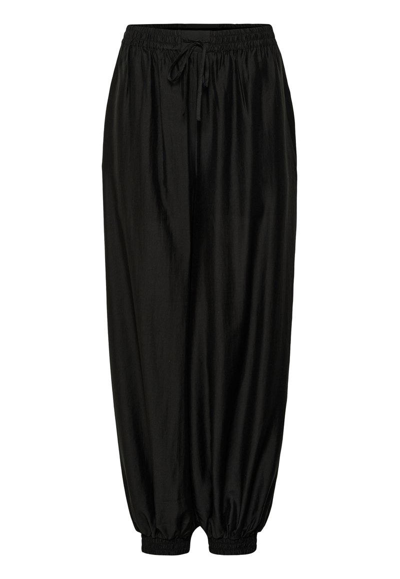 Pantalon noir à coupe ample avec taille élastique et cordon, poignets élastiques froncés aux chevilles, texture de tissu lisse.