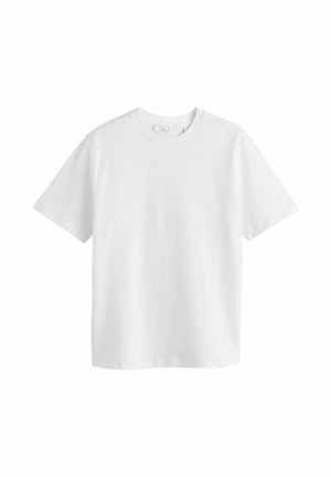 T-shirt blanc en coton. Dispose de manches courtes, d'un col rond et d'un design simple sans motifs ni accents. Coupe régulière.