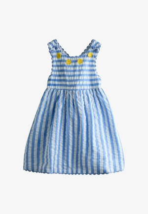 Robe sans manches pour tout-petit à rayures bleues et blanches, avec des bords ondulés, des bretelles à boutons et quatre appliques en forme de fleurs jaunes sur la poitrine.