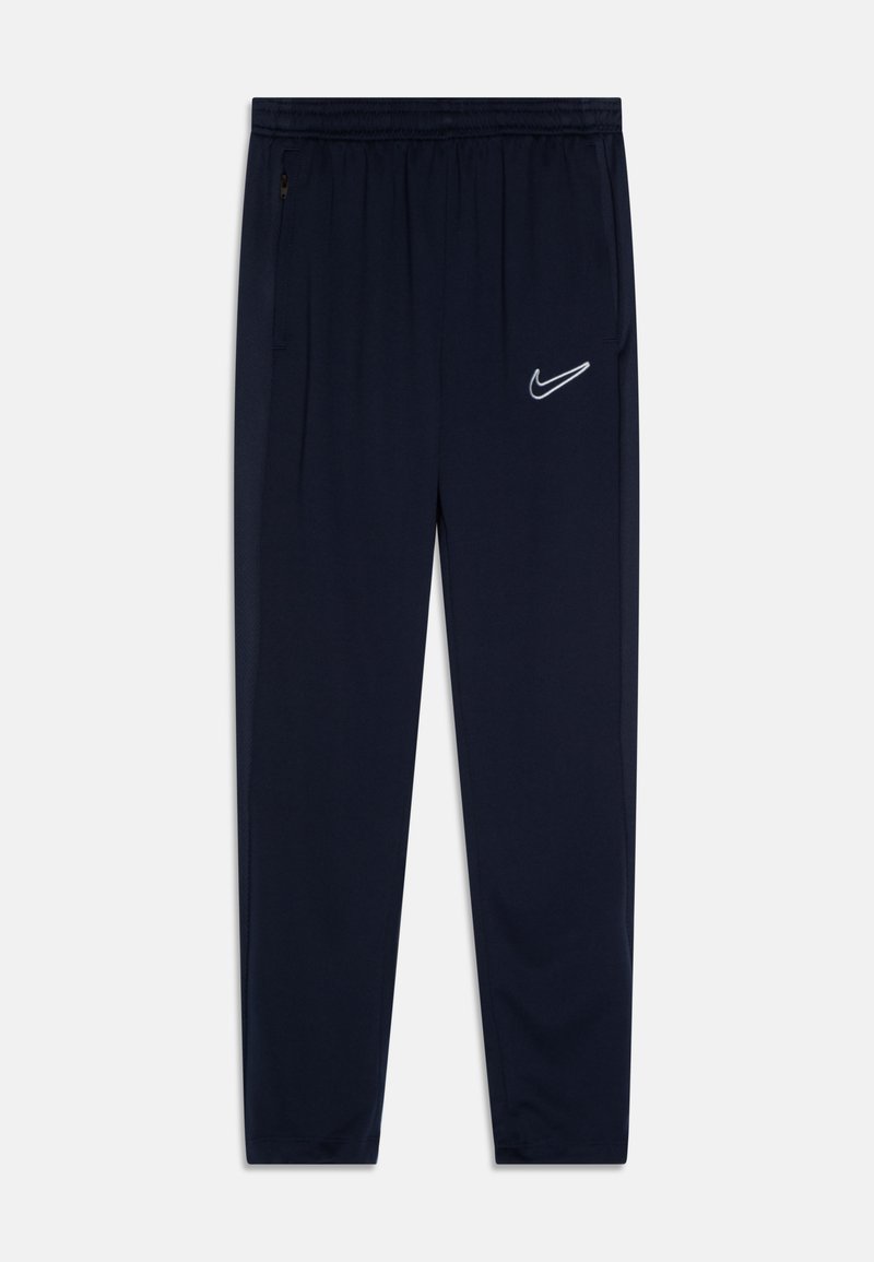 Calças de desporto na cor navy, feitas de material leve, com um cós elástico e um pequeno logotipo branco da Nike na coxa esquerda.