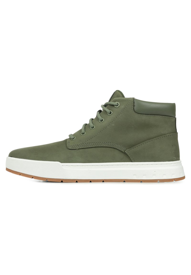 Olive green high-top shoe made from suede with a white rubber sole, round toe, and metal eyelets for laces; minimalistic design.