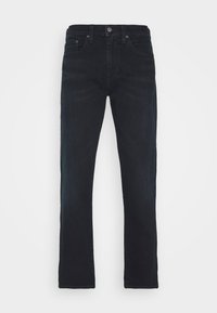 Mörkblå jeans i denim med rak benform, utrustade med klassisk femficksdesign och knappstängning framtill. Sofistikerade och mångsidiga.