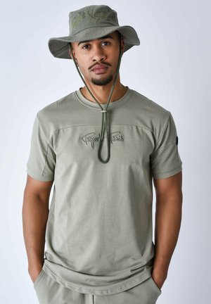 TECHNIQUE À DÉCOUPES - Camiseta estampada - olive