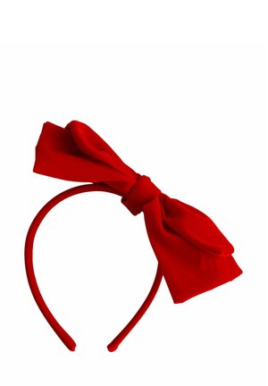 Red fabric headband with a large tied bow positioned off-center on a white background.