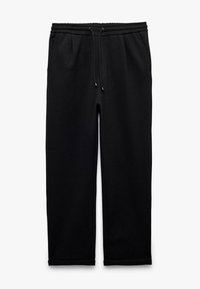 Sorte sweatpants med elastisk talje og snøre. Har sidelommer og en tapered design ved anklerne. Blød tekstur.