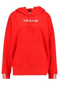 Sudadera con capucha roja de algodón, con un bolsillo frontal, cordones y el logo blanco de Adidas. Puños acanalados con detalle de tres rayas blancas.