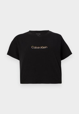 Černé krátké tričko s kulatým výstřihem a logem "Calvin Klein" v zlatobílé přechodové barvě uprostřed na hrudi.