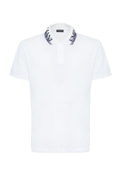 White short-sleeve polo shirt with buttoned placket and gradient collar featuring bold black "EMPORIO ARMANI" text.