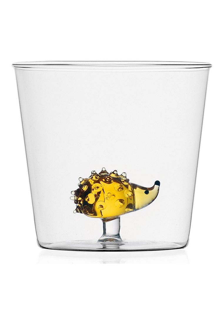 Contenedor de vidrio transparente que presenta una pequeña figura de erizo hecha de material amarillo, con púas texturizadas y un detalle de ojo azul en su interior.