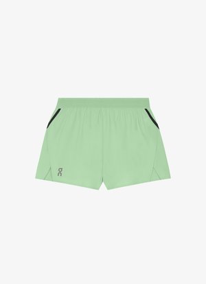 Lichtgroene sportshorts met elastische tailleband, zijzakken met zwarte bies en een klein reflecterend logo op het linkerbeen.