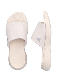 White slip-on sandals featuring a leopard print texture, smooth synthetic material, and a ridged rubber sole with a logo accent.
