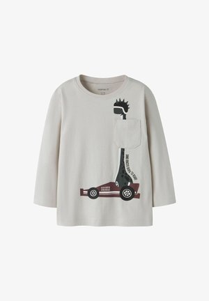 Long-sleeve beige shirt featuring a graphic of a giraffe in a race car with a black and maroon design. Includes a front pocket detail.