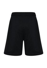 Svarta bomullsshorts med elastisk midjeband. Enkel design, knälång, sömlösa kanter och en mjuk textur. Inga fickor eller mönster.