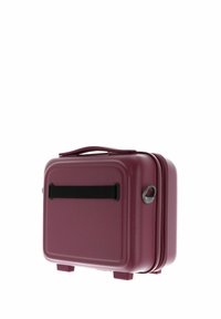 Valigia rigida compatta color mogano con maniglia laterale in tessuto nero e maniglia superiore per il trasporto, posata su piccoli piedini.