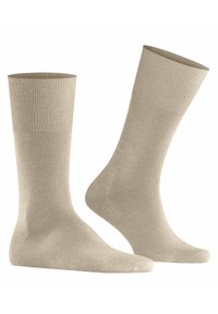 Calzini in cotone beige con bordo a coste, corpo liscio e tallone e punta rinforzati. Lunghezza fino al polpaccio con design senza cuciture per il comfort.
