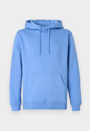 Haut à capuche bleu clair en tissu doux, avec une poche kangourou à l'avant, une capuche avec cordon de serrage et un petit logo sur la poitrine.