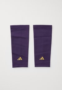 Purple arm sleeves made of smooth fabric, featuring a gold three-stripe logo at the bottom and elastic openings for a secure fit.